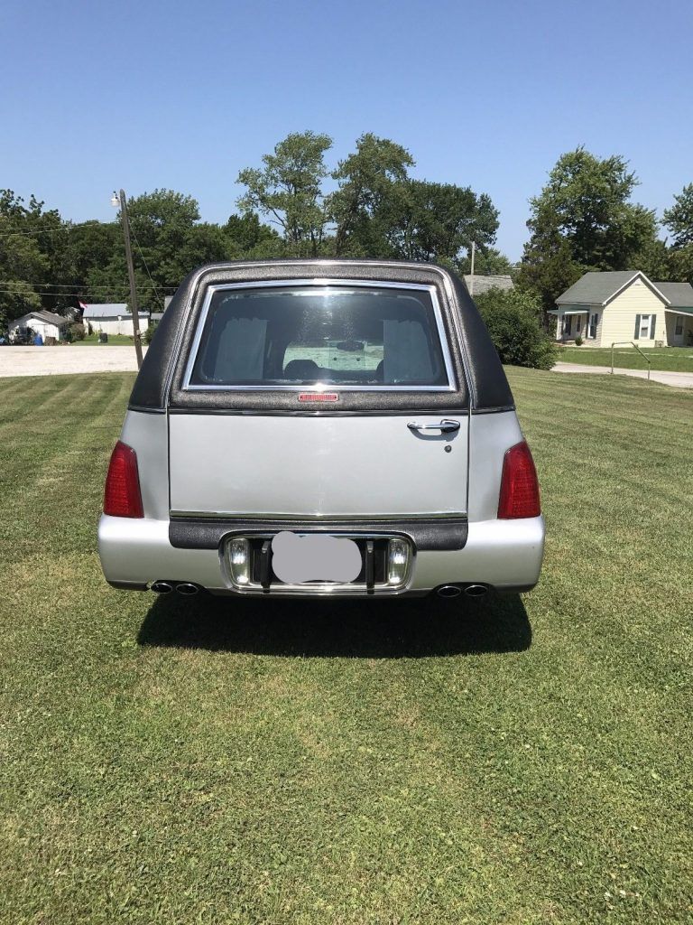 little rust 2000 Cadillac DeVille hearse