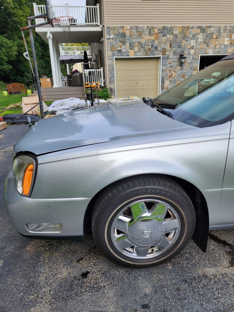 2002 Cadillac DeVille hearse [minor damage]